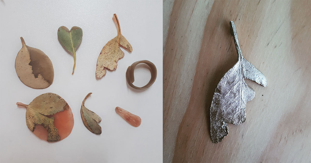 Comparison of real leaves on a white background and their metallic silver counterparts on a wooden surface.